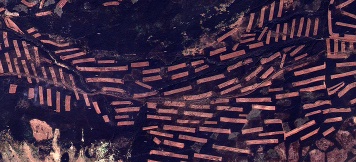 Detail satellite view from Google Maps of a section of the Peak District, showing complex traces of (presumably) some form of farming activity, reminiscent of an abstract painting with geometric shapes.