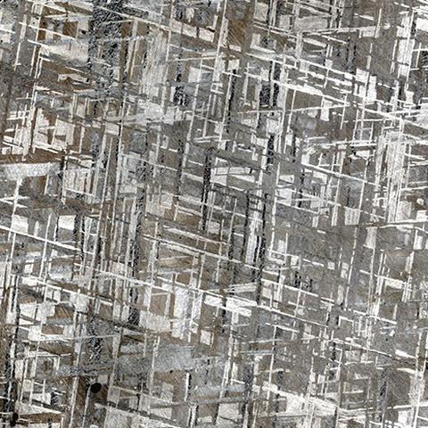 Widmanstätten structure in the etched surface of a piece from the Gibeon scattering field.

Full image source & credit:
https://commons.wikimedia.org/wiki/File:Widmanst%C3%A4tten_pattern_kevinzim.jpg