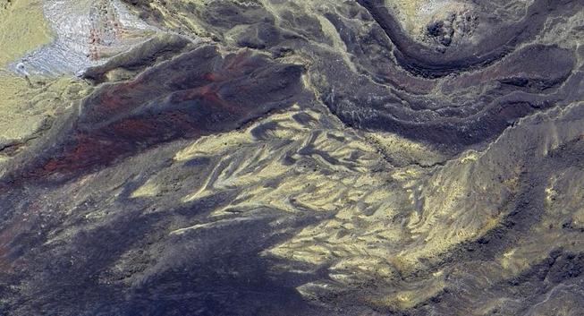 Google Maps satellite view of the volcanic landscape near Mt Tongariro with yellow minerals and erosion patterns.