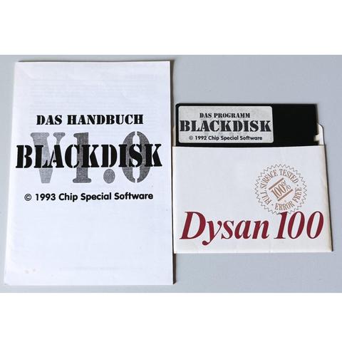 Photo of a floppy disk with a label sticker saying "BLACKDISK © 1992 Chip Special Software" and a printed manual lying next to it