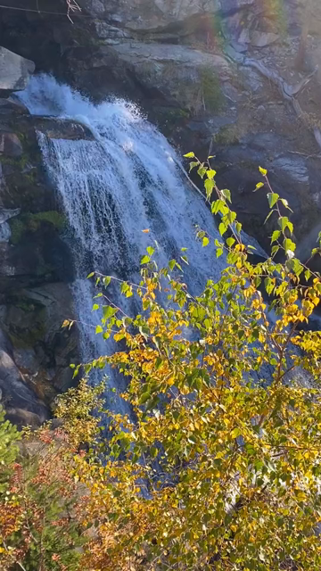 30 second POV view of a large waterfall (160 meters) crashing down into the valley, seen from near the top of the upper cascade. Beautiful autumn morning light and spray glistening in the sun.
