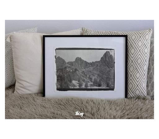 The same print as in the previous image, only here sitting on my couch, surrounded by pillows for scale.