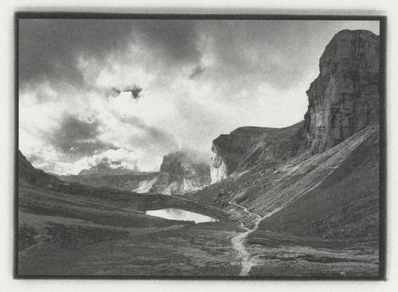 Scan of an earlier print of the same image with less contrast and detail, esp. in the clouds.