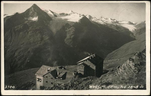 Scan of an old B&W photo postcard from 1933, showing Breslauer Hütte and the grand mountains opposite, toward Hochjochferner glacier in the background.

Image credit: Österreichische National Bibliothek
Image link: http://data.onb.ac.at/AKON/AK029_131
