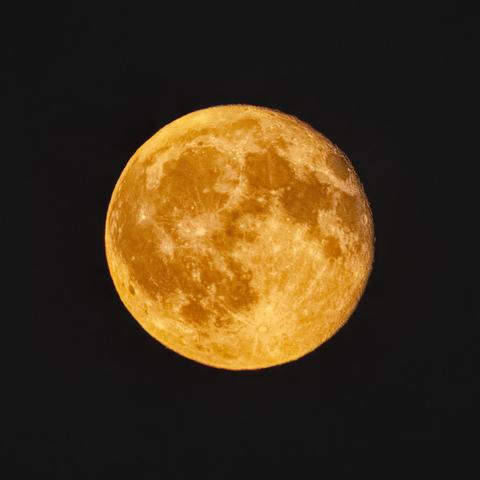 Photo of the moon in tonight's orange tint... Various lunar maria are clearly visible